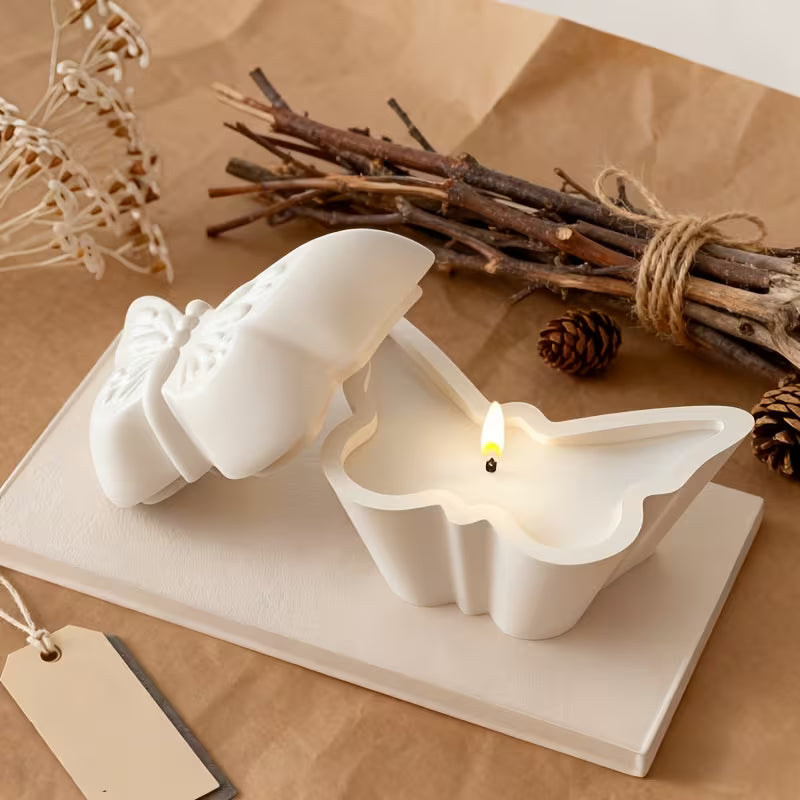 Butterfly storage jars cast in the silicone mould, one holding a candle