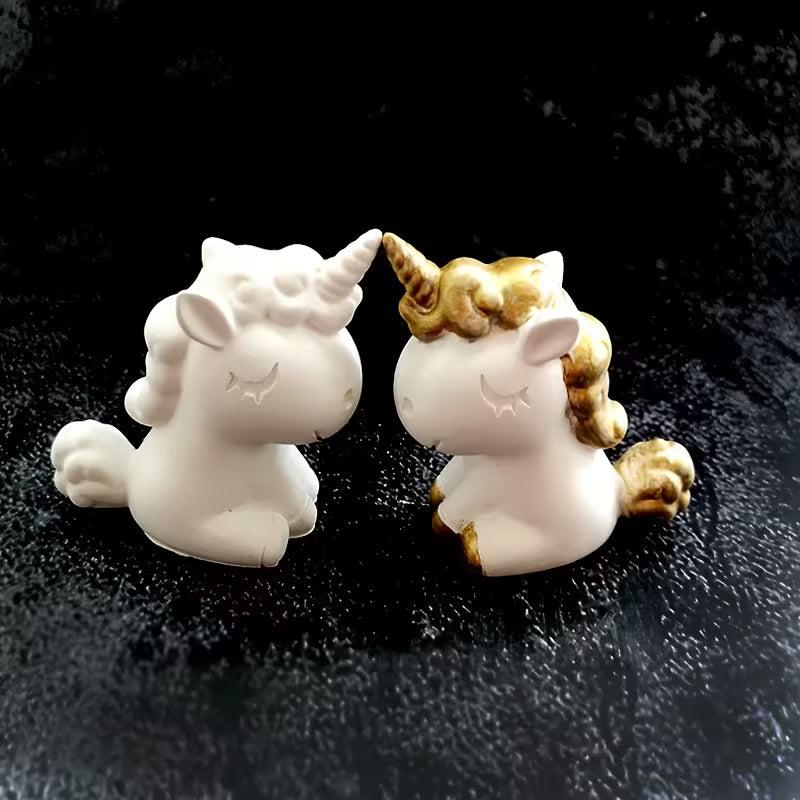 White unicorn figures with gold detail cast in the silicone mould