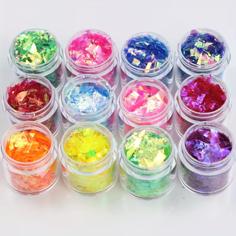 12 jars of iridescent foil flakes in assorted colours, top view