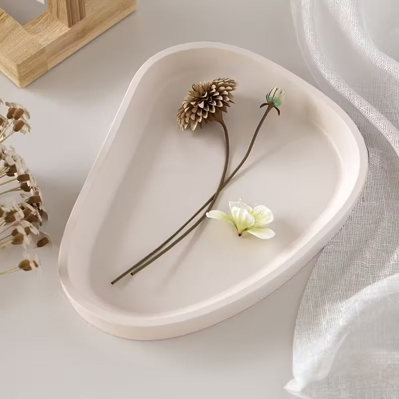 White irregular dish tray cast in the silicone mould, with dried flowers