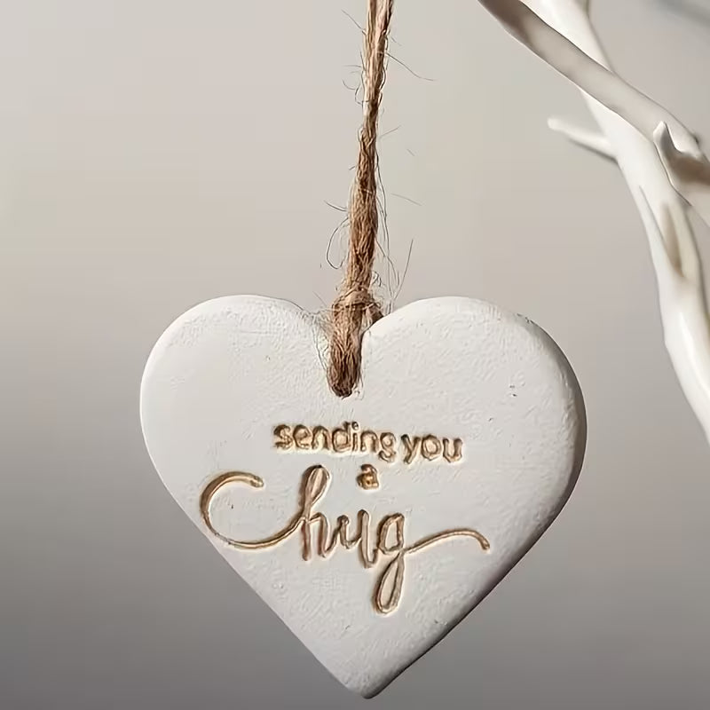 Heart keyring pendant reading sending you a hug, cast in the heart mould